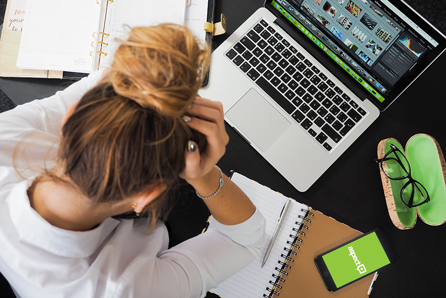 frustrated person sitting in front of laptop