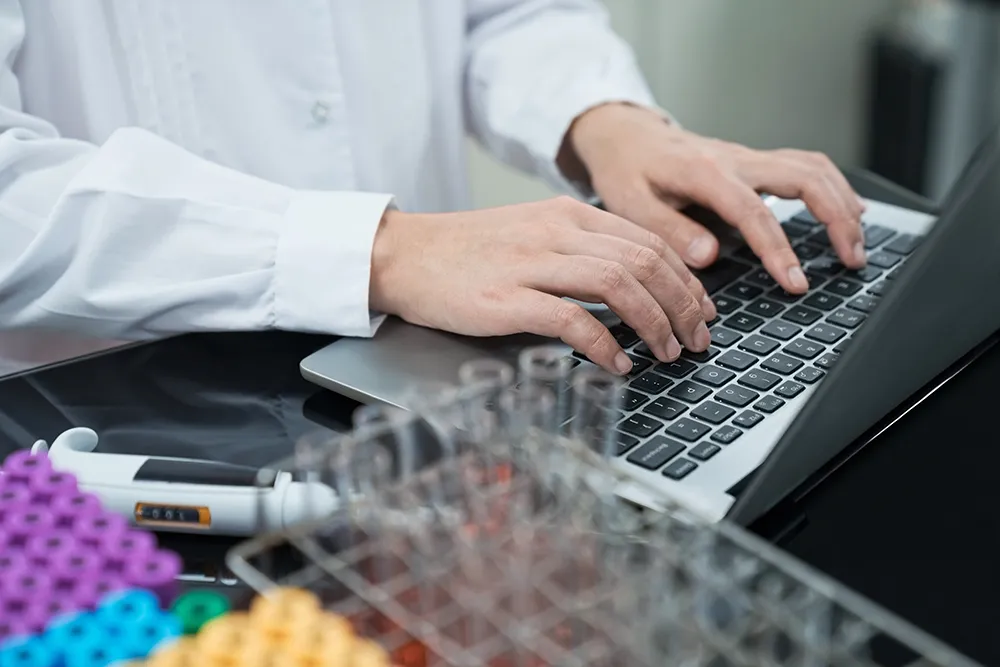 medical professional using laptop