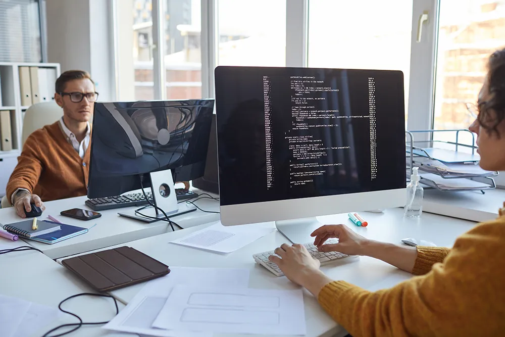 software developers coding on their computers
